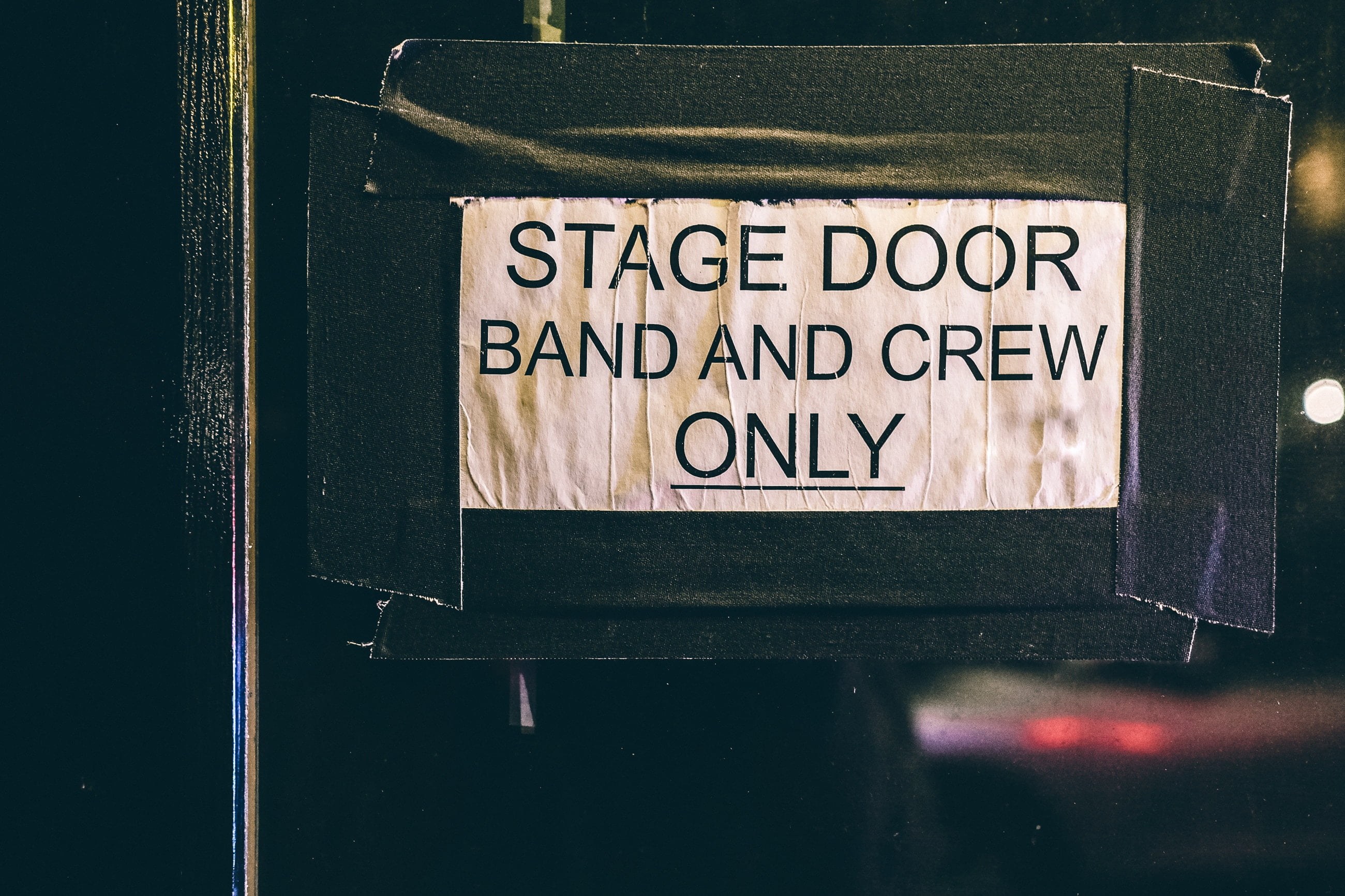 Sign saying stage door band and crew only